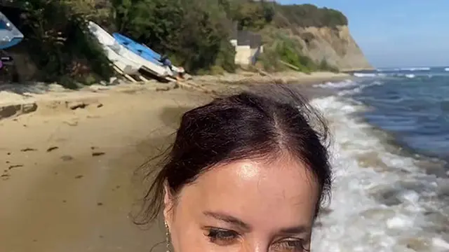 milf seduces boyfriend on a nudist beach &mdash;  eyes never leaving him