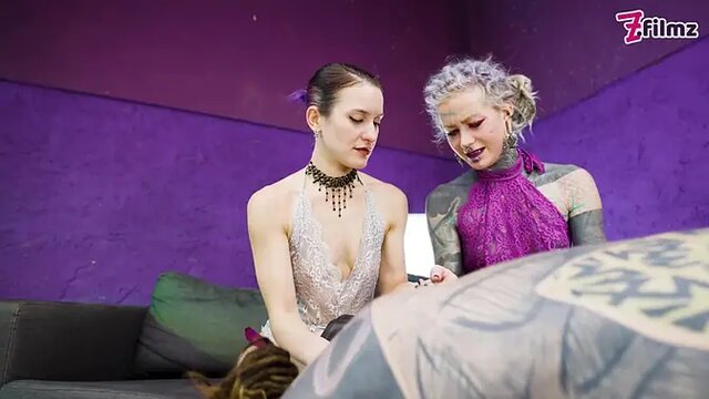 Tattooed sub gets pegged by dominant femdom duo